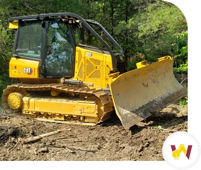 A yellow bulldozer is parked on the ground.